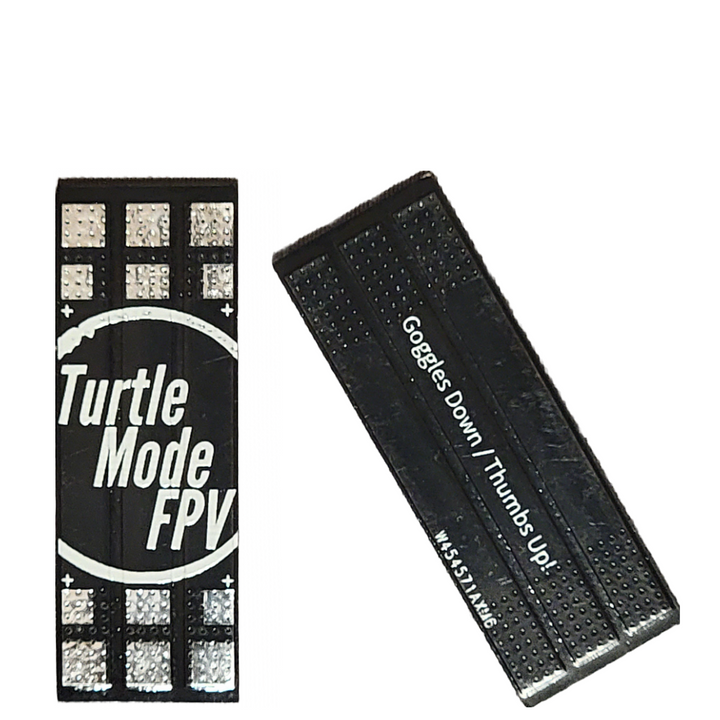 An oversized black circuit board piece with solder pads, branded with Turtle Mode FPV logo, designed for use with COB LEDs in racing electronics.